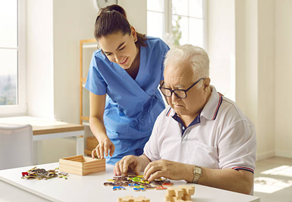 Nurse Helping a Patient Who Has Dementia